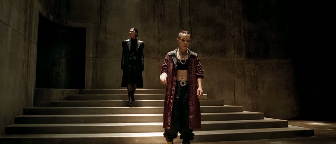 Two women on concrete steps in Veil of Maya