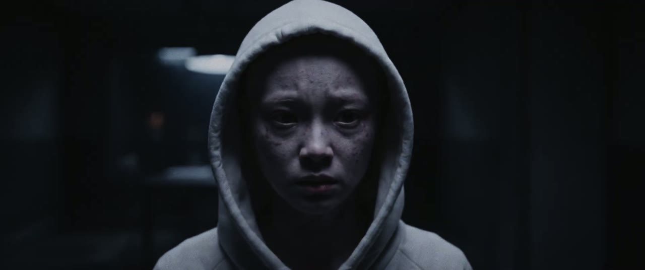 A real, exhausted girl in the same white hood and room