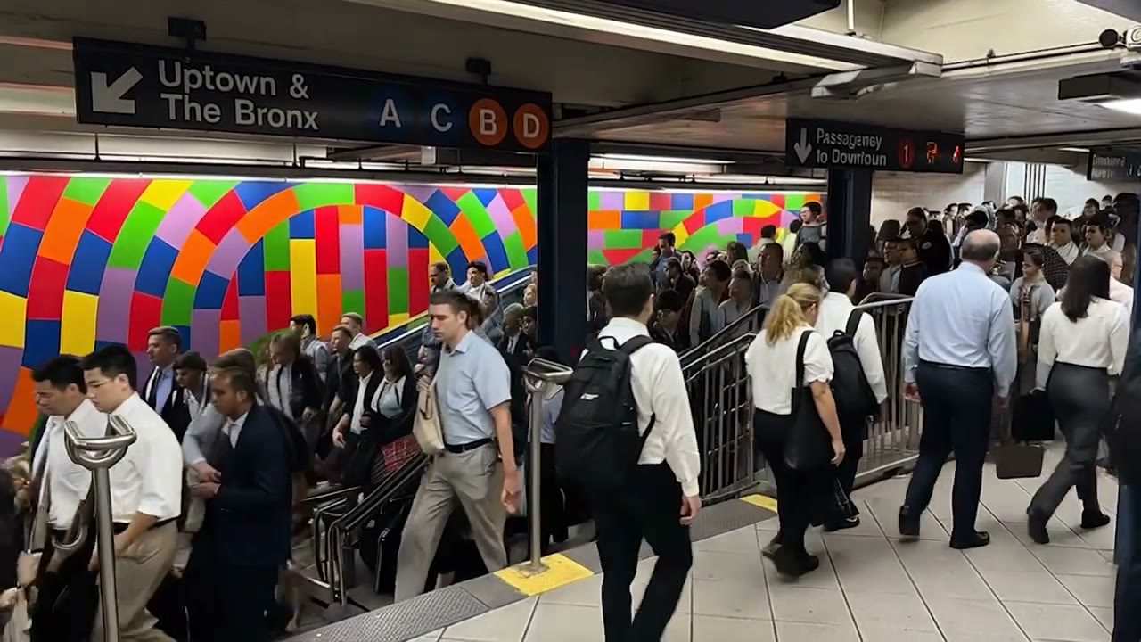 The same mosaic-walled station, crowded with commuters, generated
