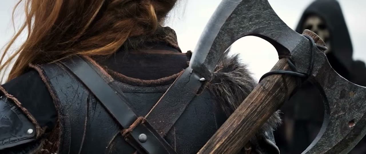 Over-the-shoulder shot of a warrior's axe, from The Bridge (2025)